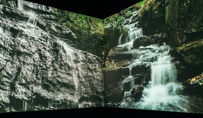 Two images of waterfalls on 2 adjoining walls
