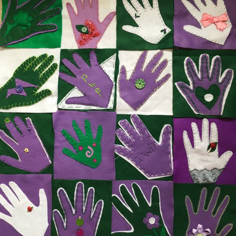 Image shows 12 outlines of hands, each contained with a square on a square grid. The hands are either white, purple, or green with a contrasting choice of these colours in the background.