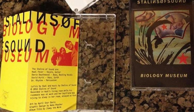 A cassette tape just out of shot and the case and insert featuring the artwork of April Star.
