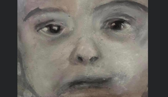 A pastel drawing of a young child. The image is cropped, focusing on their dark eyes, nose and mouth