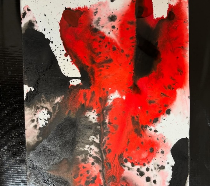 A red and black abstract ink painting. 
