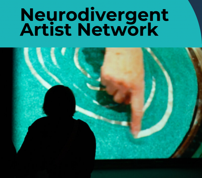 image of a person in silhouette watching a screen showing a finger tracing a spiral line in blue sand.