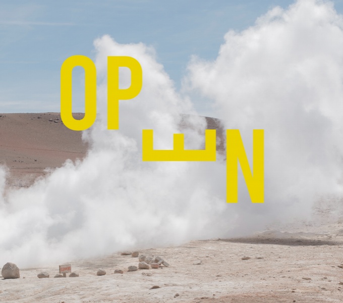 Image shows a desert-like landscape with blue sky. Smoke billows across the landscape. The word OPEN is written in yellow capitals across the smoke. The letter E is rotated 90 degrees counter-clockwise in the word.
