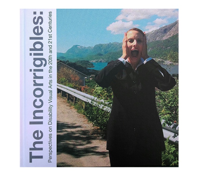Cover of the DASH Incorrigibles book. A woman in a black suit hold her hads to her face as she screams. Behind her is a mountain range and a large lake.