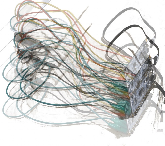 An illustration of coloured wires feeding into an electrical circuit board.