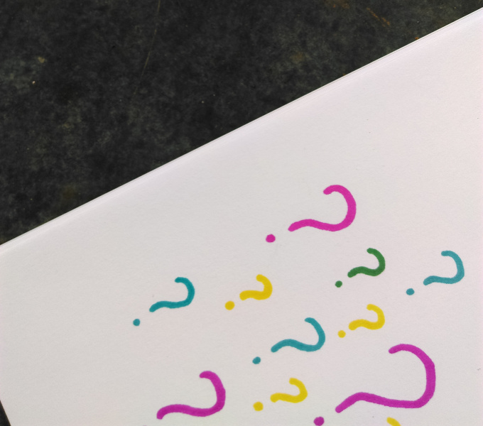 A page of questions marks in blue, gree, pink and yellow.