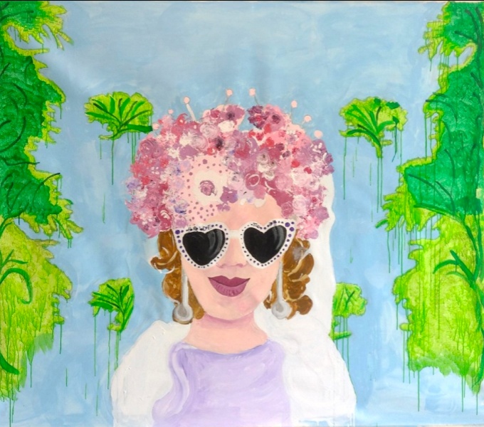 A square painting with a female figure in the centre surrounded by greenery in front of a blue background. The figure has brown curly hair and wears a lilac dress, white veil and shawl. She wears heart shaped sunglasses & long silver earrings. Her hair i