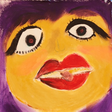 A hand painted close up of a face. The face is yellow in colour with large bright red lips and large eyes with apparent black eyeliner.