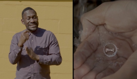 A Black man is signing on the left whilst on the right someone pours water into the Black boi’s open hand. On top of the hand is a circular water caption symbol with the word ‘Flow’.