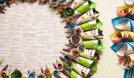A part image of a wreath, created from party political electioneering material, which highlights the deaths of those people affected by the 'Bedroom Tax'.