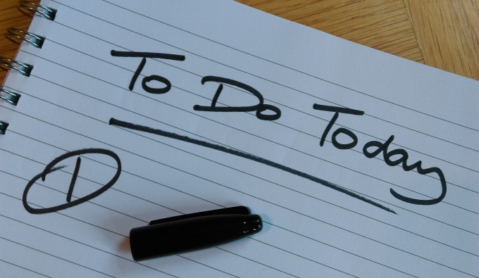 A white lined sheet of A4 paper with the words 'To do today' written by hand in thick black pen. The pen lid rests on the paper below. 